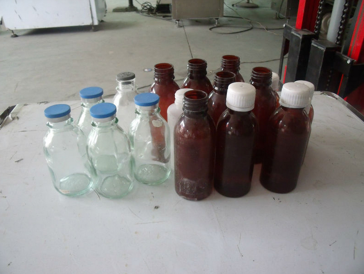 powder filling capping machines qapaqları doldurmaq üçün butulkalar.jpg